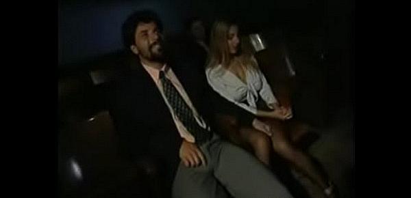  Blonde mom filled with two cocks at the cinema